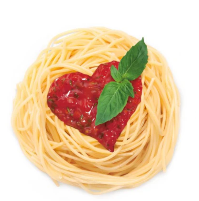 Spaghetti nest with heart-shaped tomato sauce and fresh basil